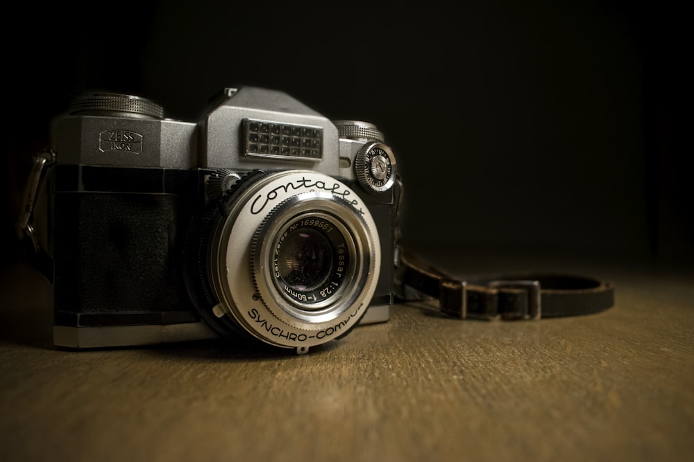 closeup photography of gray and black camera on table