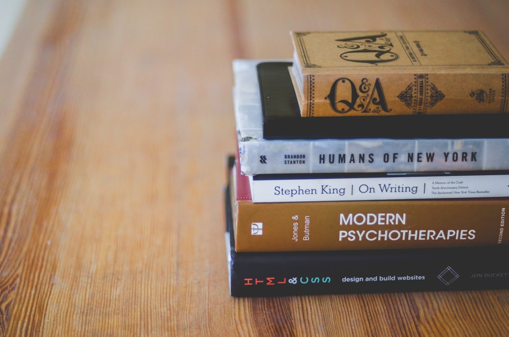 assorted reading books on table