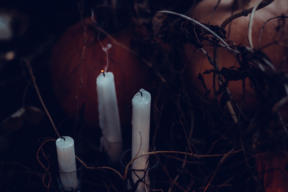 Three tall white candles.