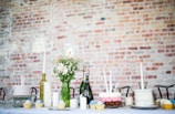 cake beside candles and flowers