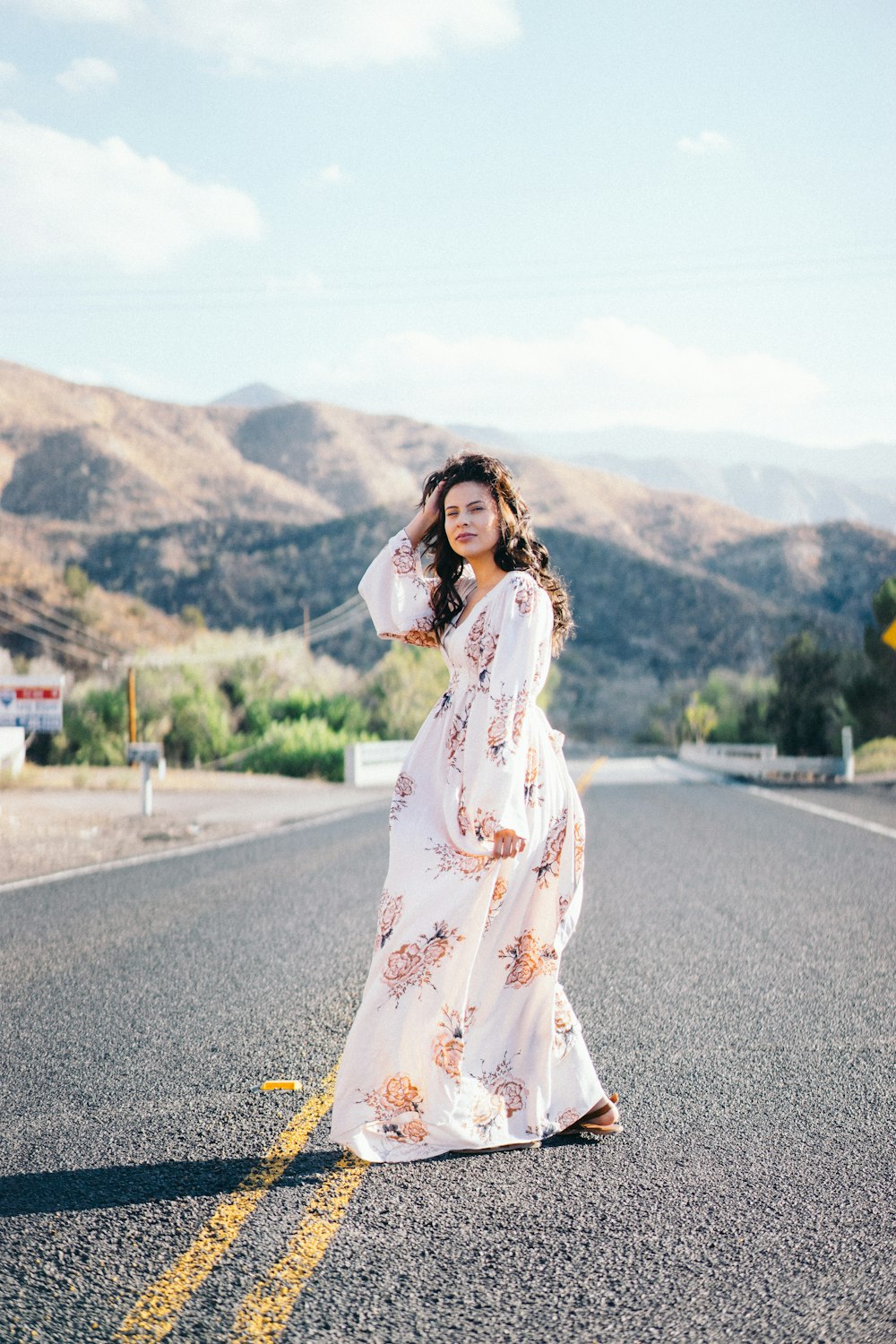 woman standing in the middle of the road