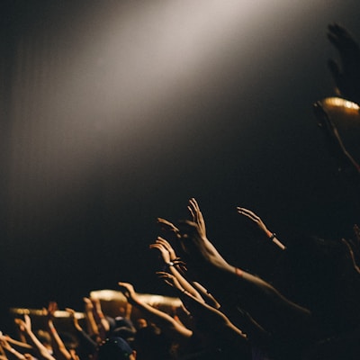 group of people waving their hands