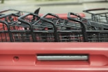 A close-up of a shopping cart filled with discounted items.