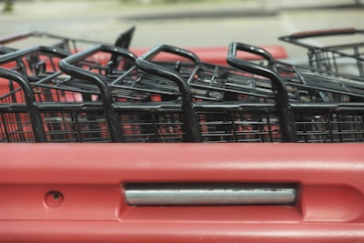 A close-up of a shopping cart filled with discounted items.