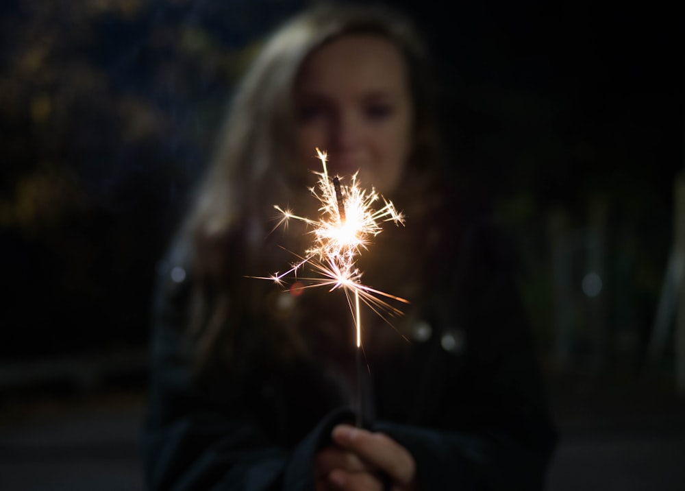 woman holding sparkler