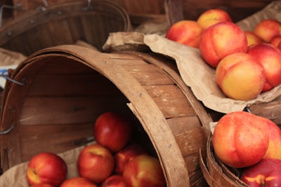 Baskets filled with a colorful mix of farm-fresh peaches and plums.