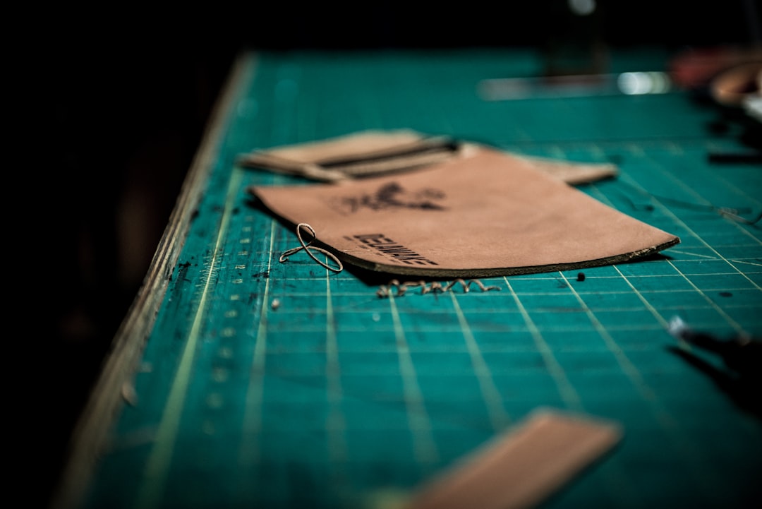 green carton, Leather on cutting board