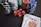 Stacks of poker chips in various colors including black, white, red, blue, and green are accompanied by red dice and a hand of playing cards featuring face cards such as the Queen and King of Clubs.