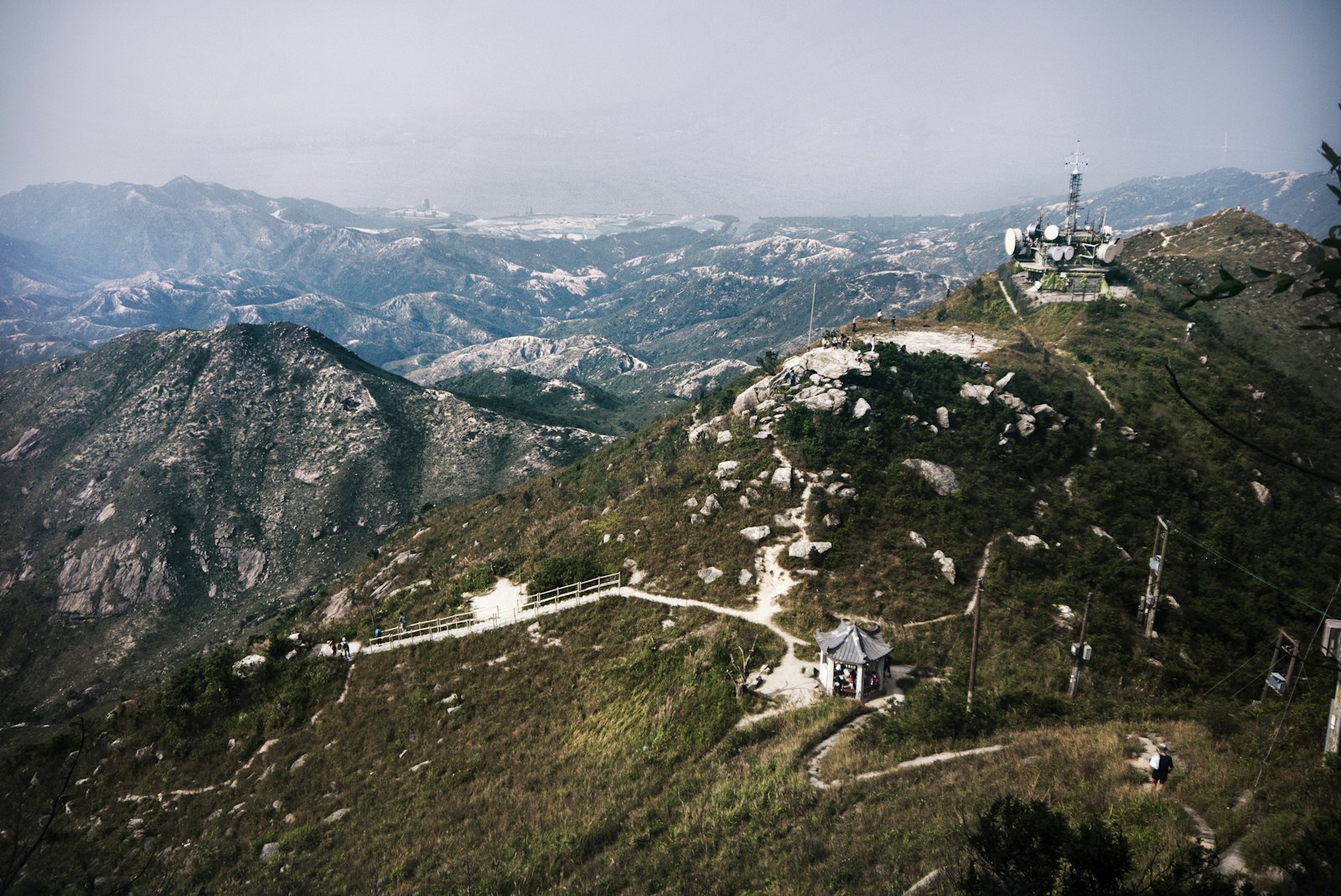 Panasonic Lumix G Vario 14-42mm F3.5-5.6 ASPH OIS sample photo. Houses on green mountains photography