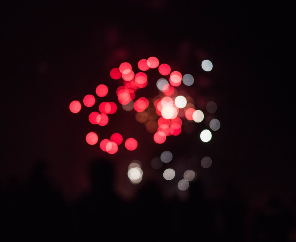 a bunch of red and white lights in the dark