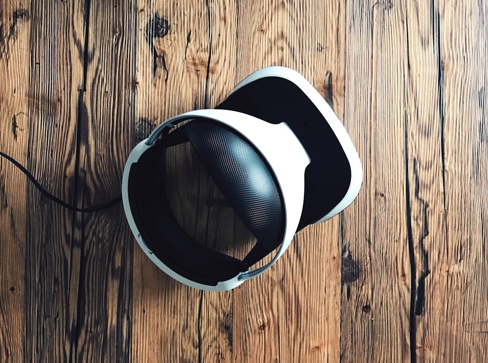 white and black Bluetooth headphones