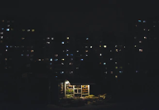 Modern autonomous minimarket kiosk inside a residential building hallway.