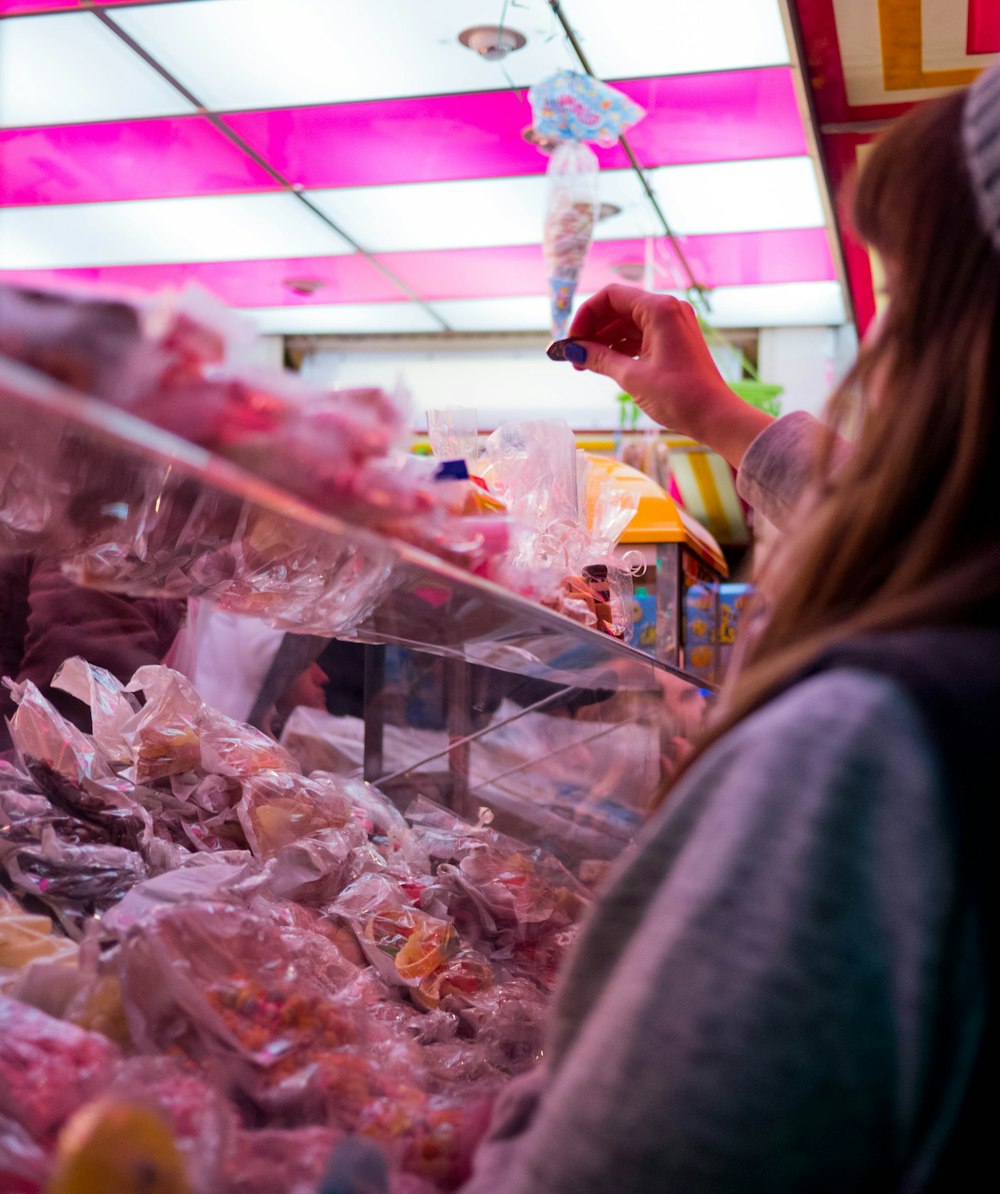 woman standing near plastic packs