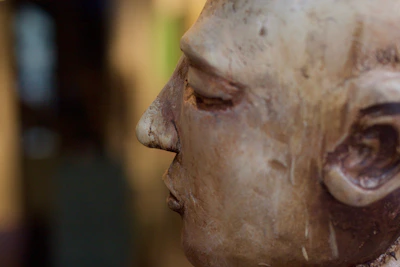 Close-up of handcrafted wooden sculpture showing detailed craftsmanship and texture.