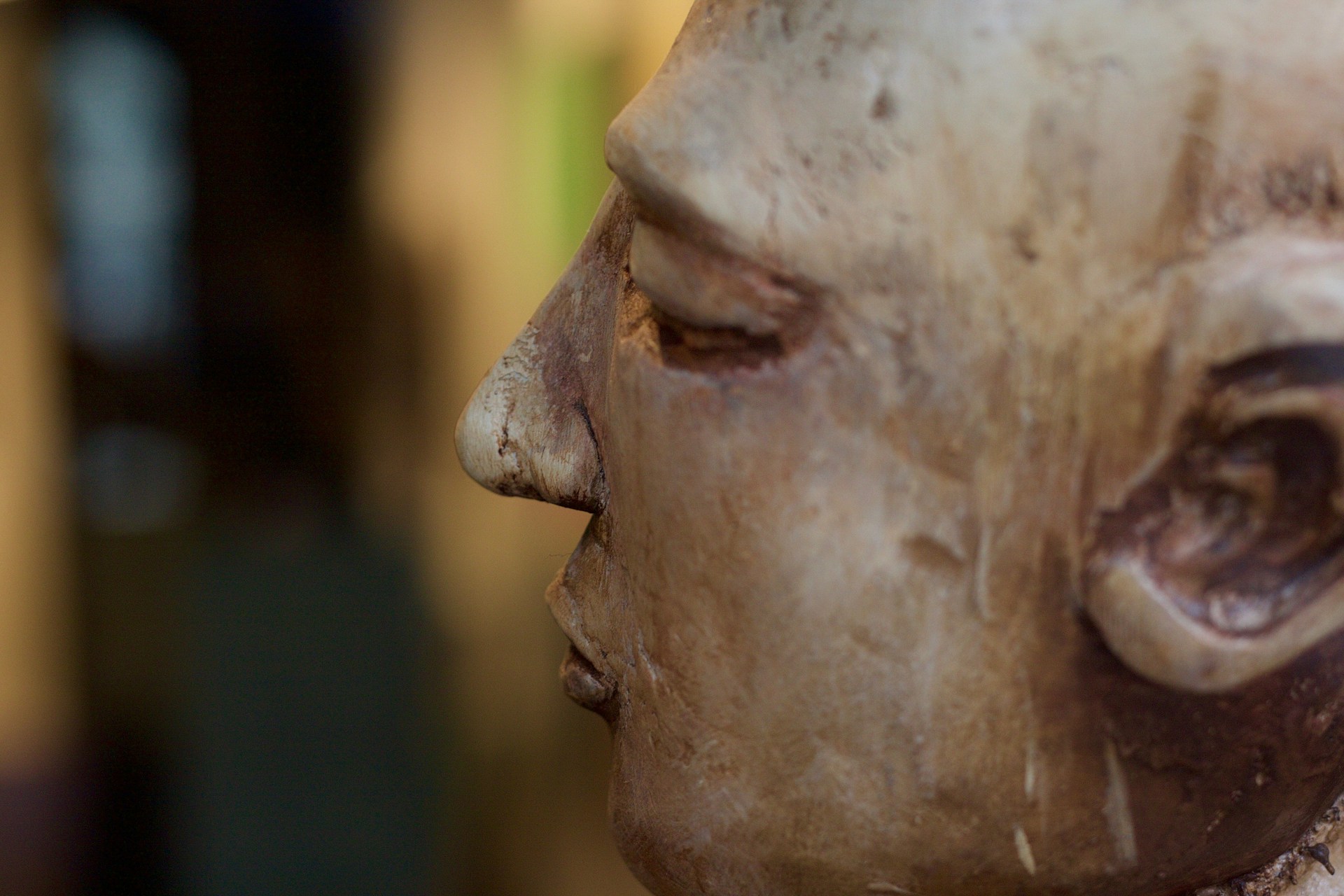 A close-up shot of a handcrafted wooden sculpture, highlighting the intricate details and textures carved by skilled hands.