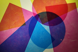 Geometric abstract shapes overlapping in bright hues.