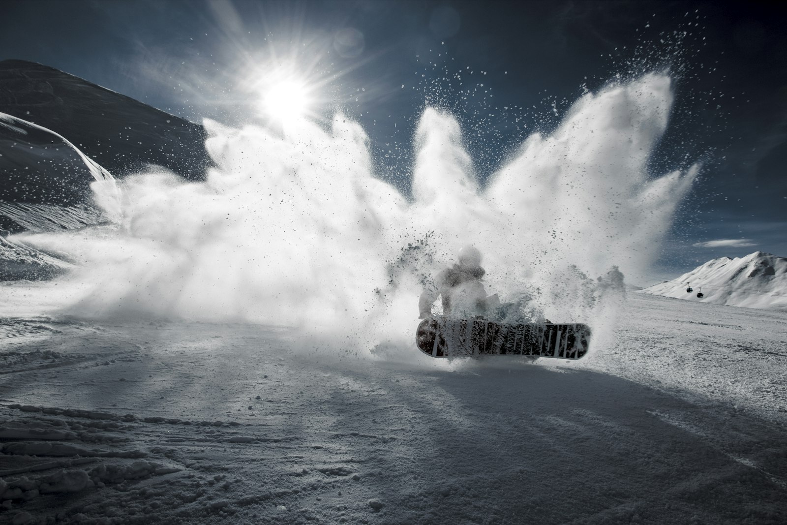 Snowboarder carving through fresh powder