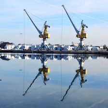 Cranes loading cargo at a dock.