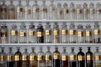 Bottles of various research chemicals neatly arranged on a shelf