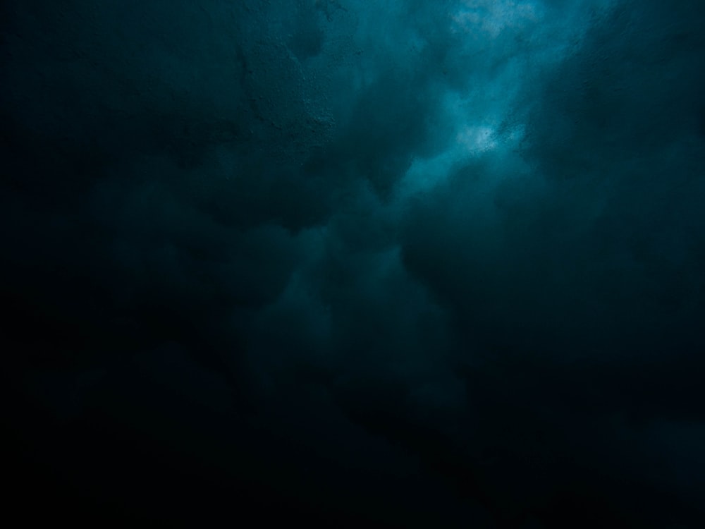 a large body of water under a cloudy sky