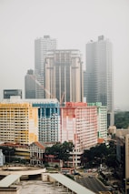 multicolored concrete high rise building near water