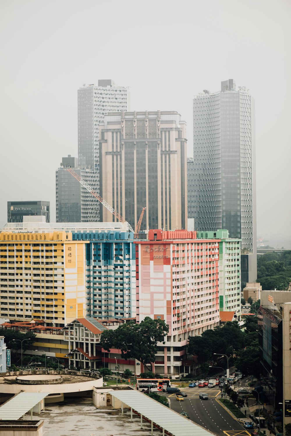 multicolored concrete high rise building near water