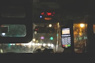 A close-up of a taxi meter displaying fare information.