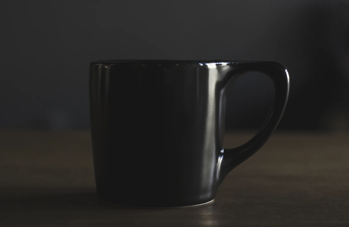 Matte black mug in low light