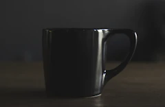 Matte black mug in low light