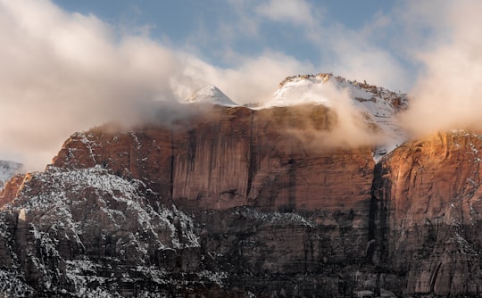 white covered rock mountains under white sky in Zion National Park United States