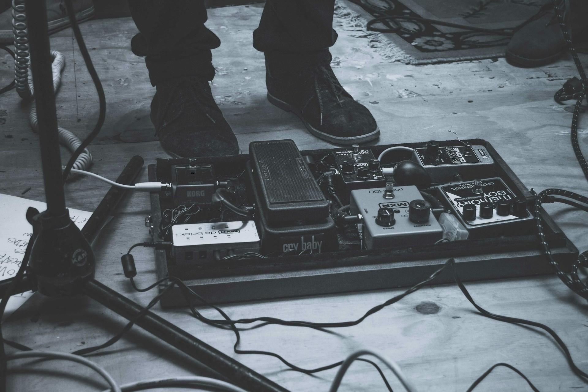 person wearing pair of black sneakers