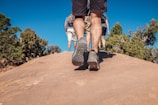 man walking brown sand