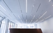 A modern office space illuminated with LED lighting.
