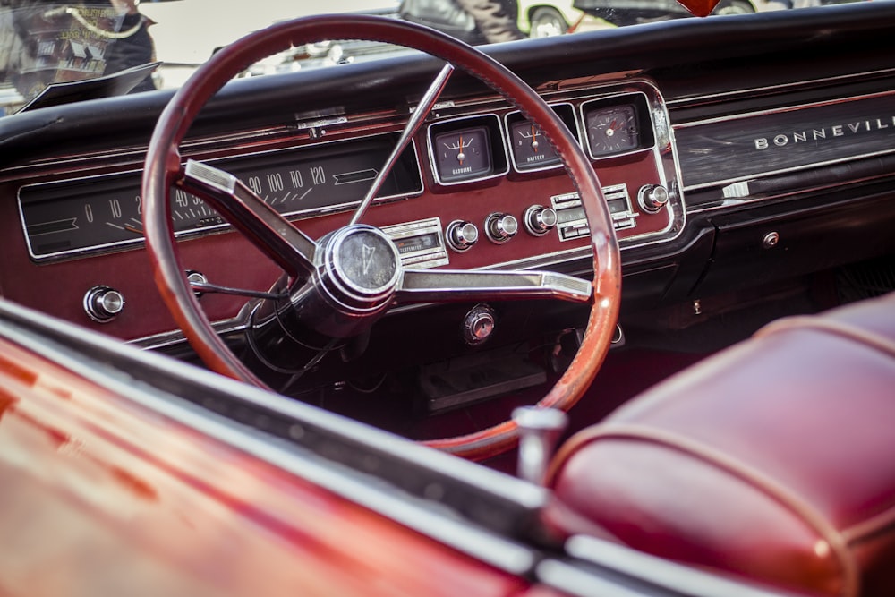 selective photography of red steering wheel