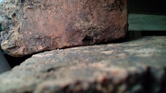 Close-up of a stack of durable refractory bricks with a textured surface.