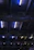 Close-up of a sleek LED high bay light casting bright, uniform beams in a modern industrial warehouse.
