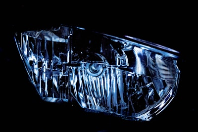 a close up of a car headlight in the dark