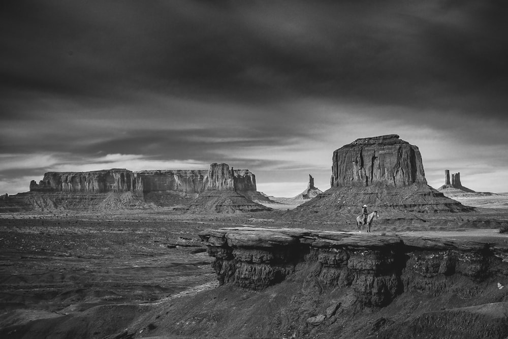 grayscale photo of rock formation