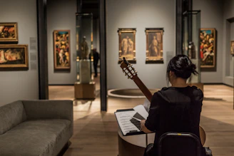 woman playing classical guitar