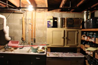 The cleared basement, freshly cleaned and organized with new lighting.