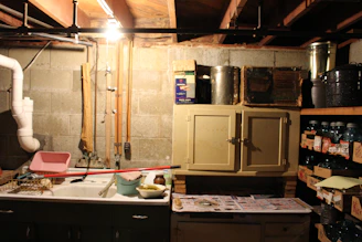Restoration crew using advanced drying equipment in a flooded residential basement.