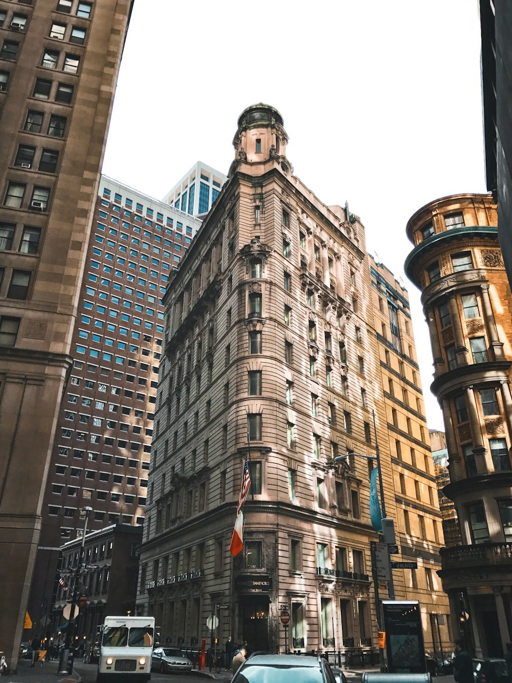 low angle photography of brown high rise building