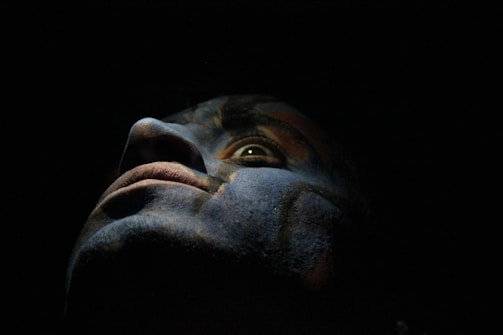 Close-up of a photorealistic character design with dramatic lighting.