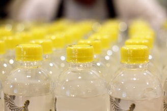 A close-up of clear plastic bottles arranged neatly.