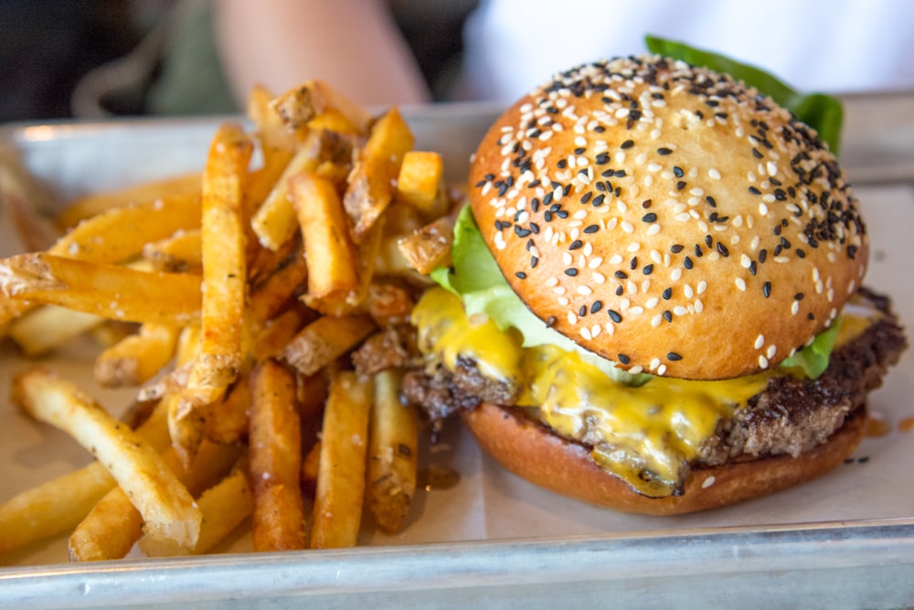 selective focus photo of burger and fries
