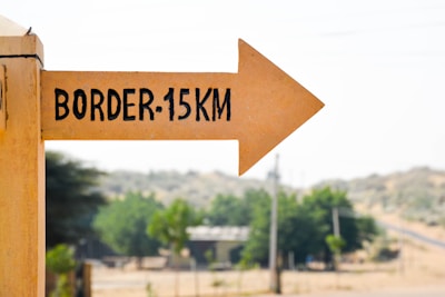 Close-up of a plot boundary marker with clear signage.