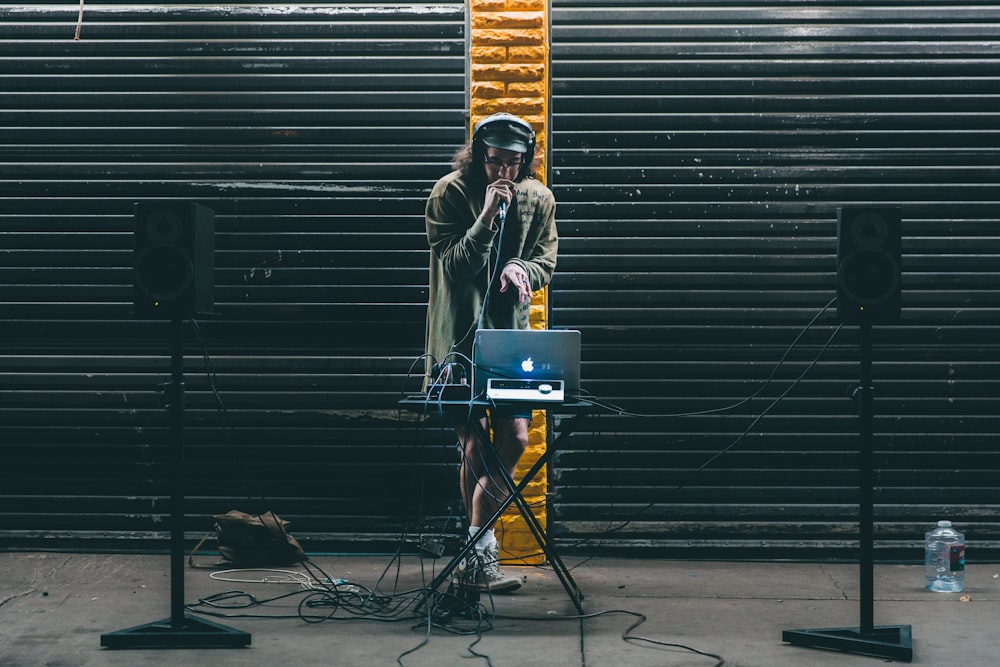 man in front of MacBook