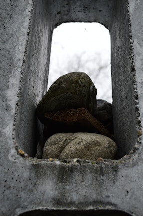 A sturdy rock dumpster filled with concrete debris.
