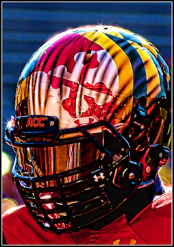 Close-up of a football helmet with the Brazilian flag painted on it
