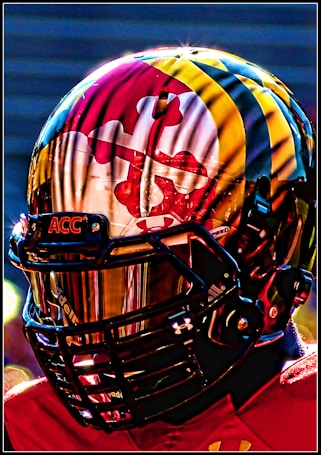 A detailed and vibrant close-up of a football helmet with intricate designs and reflective details, featuring bold, vivid colors and a shiny visor.
